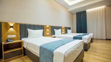 Standard Triple Room | 1 bedroom, in-room safe, desk, laptop workspace