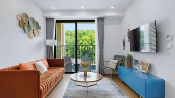 Comfort Apartment, Balcony, Mountain View | Living area | 50-inch flat-screen TV with satellite channels