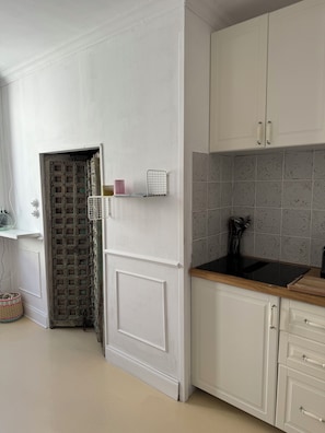 Effortlessly prepare meals in this well-equipped kitchen with a tile backsplash and ample storage.