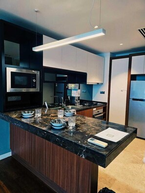 Departamento Confort, vista a la ciudad | Cocina privada