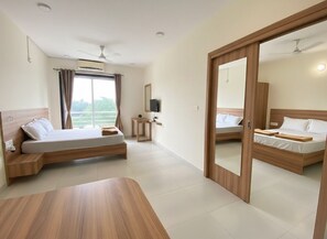 Premium Family Room | Bed sheets - Kamal Bliss Resort (Karjat)