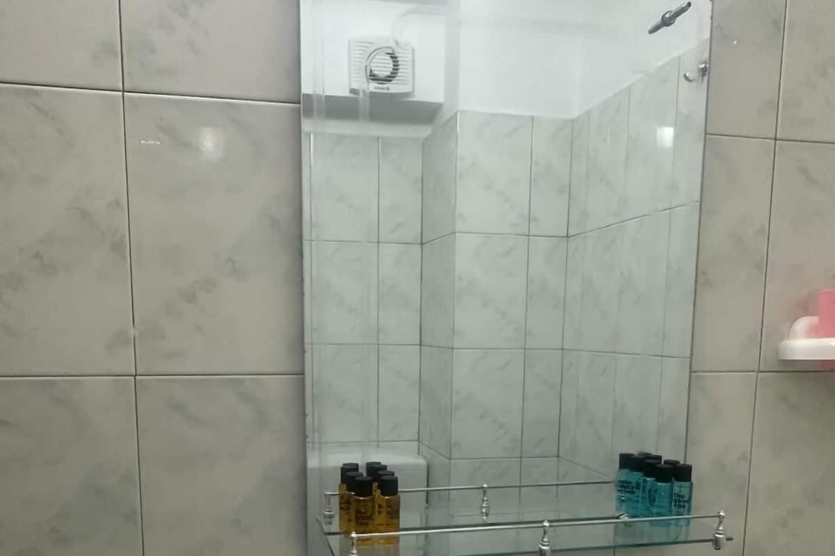 Shower, hair dryer, towels, shampoo