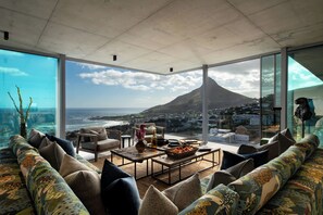 Apartment | Living area | 60-inch Smart TV with digital channels, iPod dock, MP3 dock - An African Story (Cape Town)