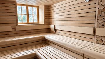 A sauna with wooden benches and a window.