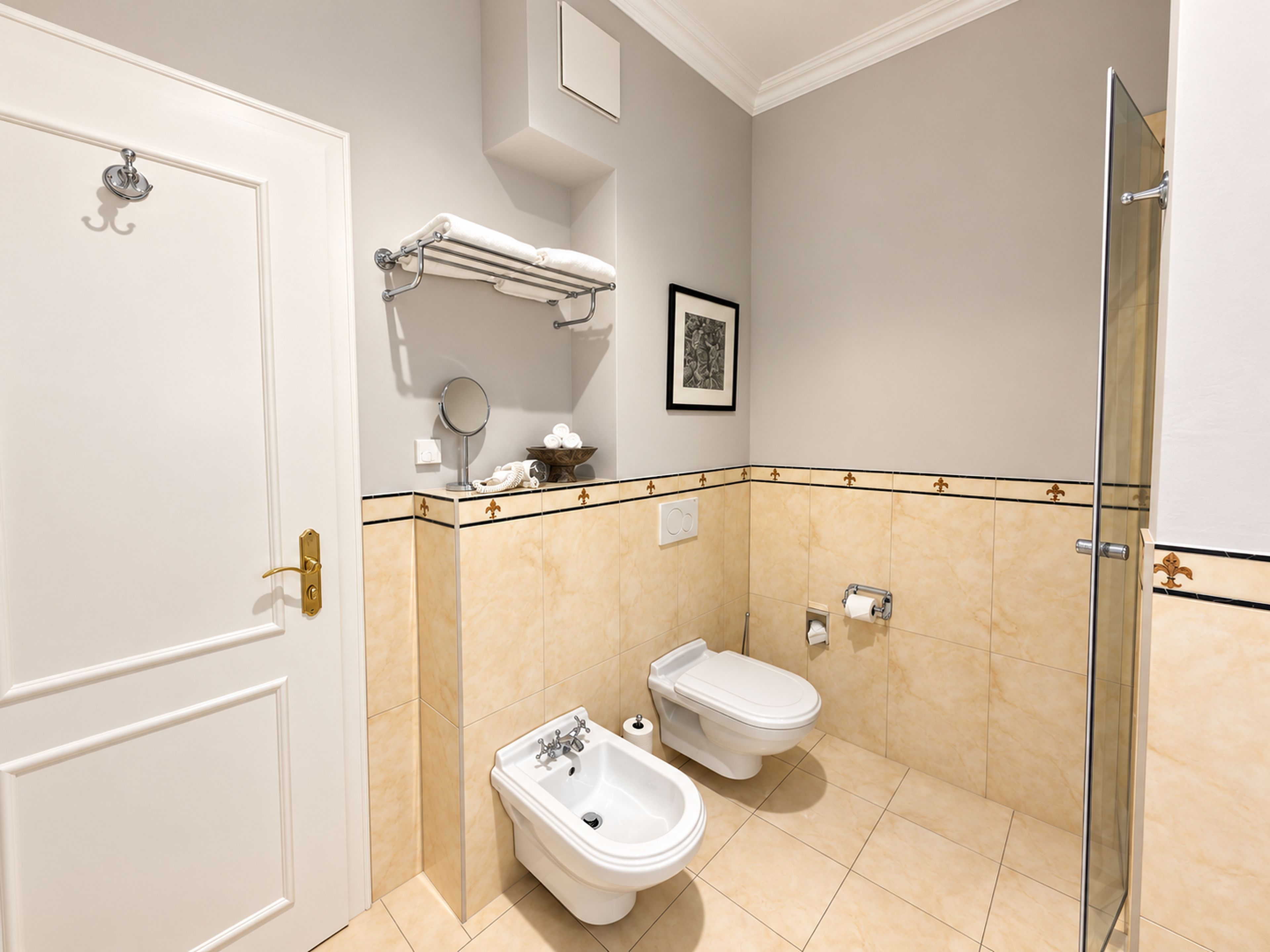 Baño con inodoro, bidé y zona de ducha.