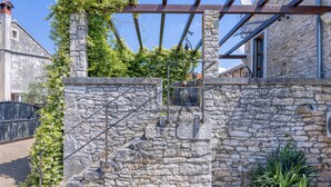 A stone staircase leading up to a wooden pergola with a metal railing. - Casa Rustica Felker With Private Pool (Marcana)