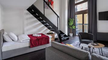 Apartamento conforto, sacada | Área de estar | TV de tela plana 40 polegadas com canais a cabo