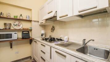 Apartment, Garden View | Private kitchen | Fridge, microwave, stovetop, espresso maker