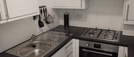 Fridge, microwave, oven, cookware/dishes/utensils
