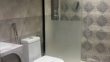Bathtub, hair dryer, slippers, soap