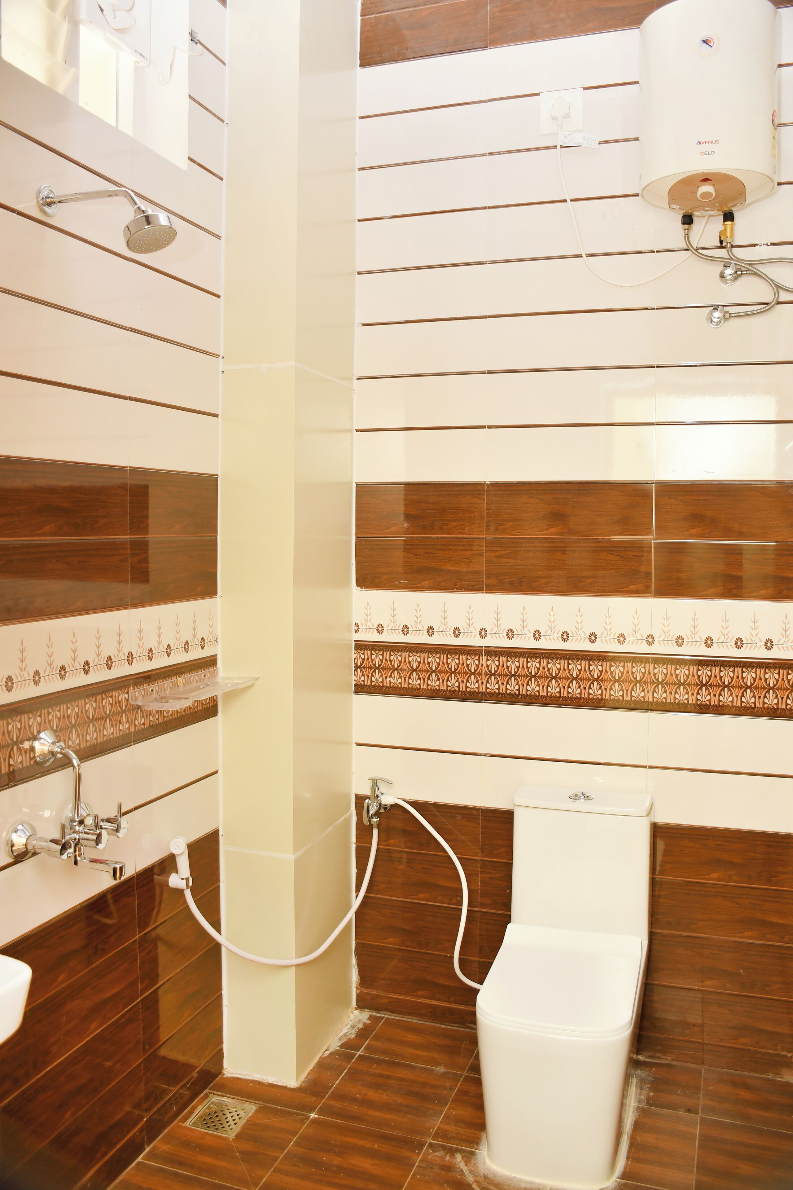 A bathroom with a shower, toilet, and sink.