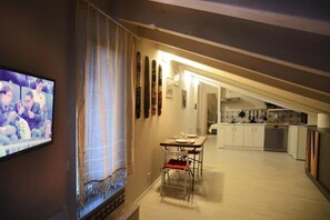 Apartment, Sea View | Living area | Flat-screen TV