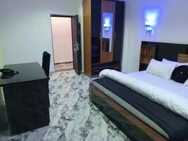 Deluxe Room, Balcony, City View | Desk, laptop workspace, blackout drapes, soundproofing