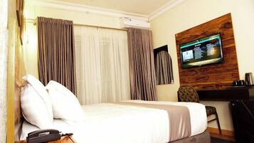 Economy Apartment, Balcony, City View | Desk, laptop workspace, blackout drapes, soundproofing