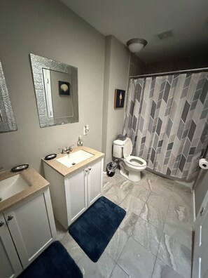 Shower, hair dryer, towels, soap