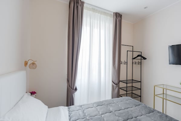 1 habitación, tabla de planchar con plancha, wifi gratis y ropa de cama 