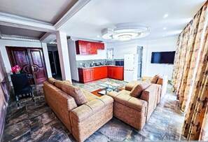 Comfort Apartment, Balcony | Living area | TV