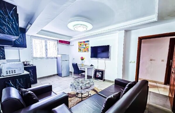 Comfort Apartment, Balcony | Living area | TV