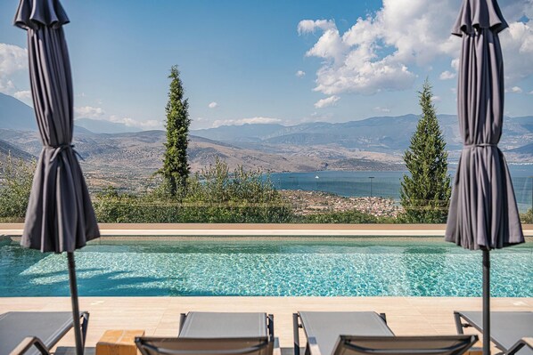 Outdoor pool, pool umbrellas, sun loungers