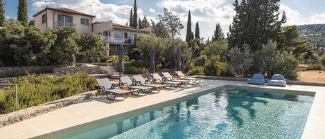 Outdoor pool, pool umbrellas, pool loungers