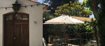 Town house. Large wooden terrace. Enclosed garden with century-old trees.