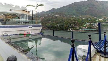 Outdoor pool, pool umbrellas, pool loungers