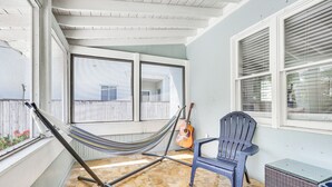 A patio with a hammock, a guitar, a chair, and a small table. - 4 Mi to Beaches: Tranquil Fort Lauderdale Escape (Fort Lauderdale)