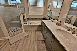 A modern bathroom with a walk-in shower, a bathtub, and a large sink. - Rehoboth Beach, Dog Friendly, 5BR, 3 Full Baths, Arbor-Lyn Community, Sleeps 12 (Rehoboth Beach)