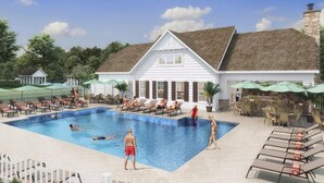A swimming pool area with lounge chairs and umbrellas, surrounded by a white building with a gabled roof. - Rehoboth Beach, Dog Friendly, 5BR, 3 Full Baths, Arbor-Lyn Community, Sleeps 12 (Rehoboth Beach)