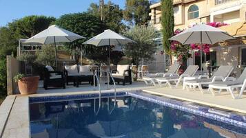 Seasonal outdoor pool, pool umbrellas, pool loungers