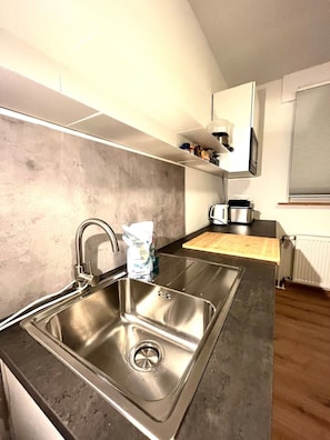 Fridge, microwave, stovetop, coffee/tea maker