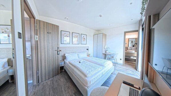 Desk, laptop workspace, free WiFi, bed sheets