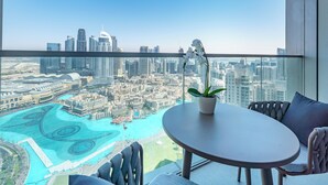 A balcony with a view of a cityscape and a marina. - Sky-High Burj Khalifa and Fountain Views (Dubai)