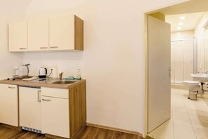 Fridge, stovetop, coffee/tea maker, cookware/dishes/utensils