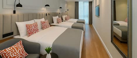 Quadruple Room | Minibar, in-room safe, soundproofing, iron/ironing board