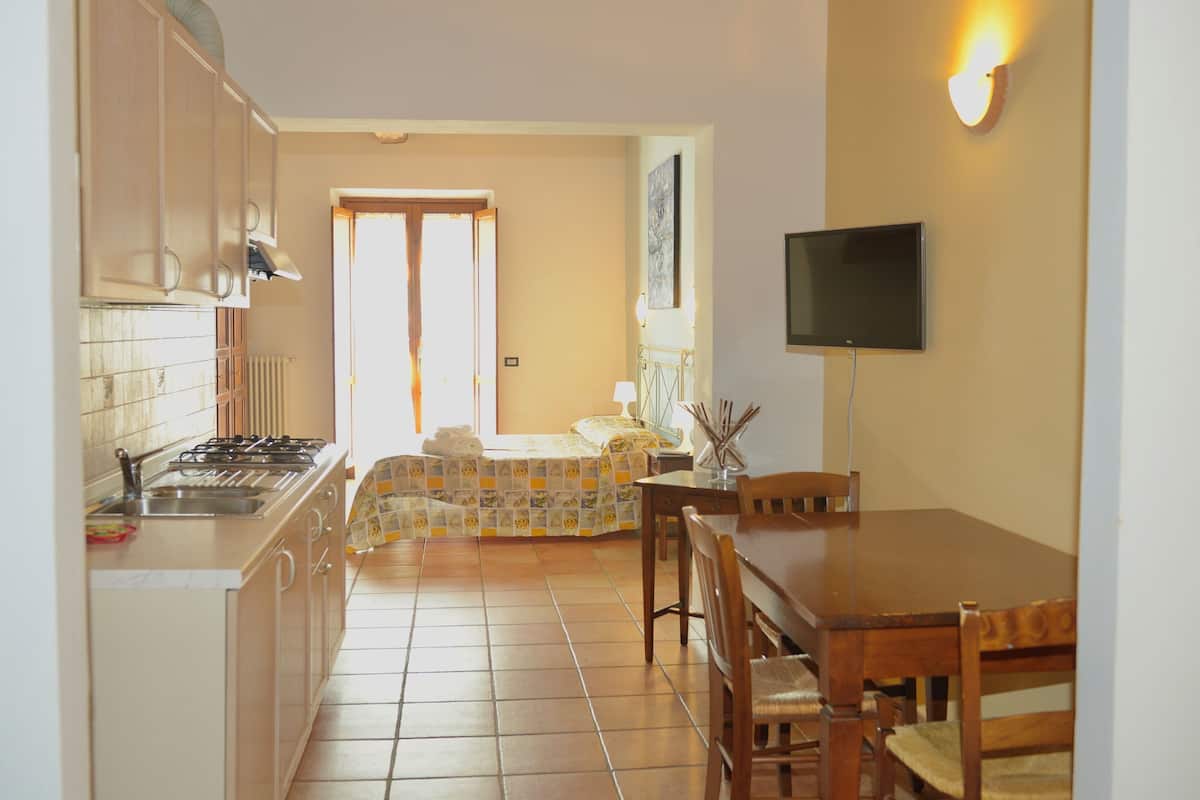 Studio | Living area | 24-inch flat-screen TV with cable channels