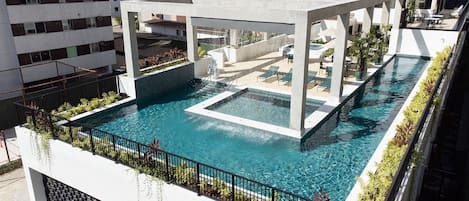 Indoor pool, pool umbrellas, sun loungers