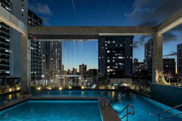 Indoor pool, pool umbrellas, pool loungers