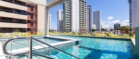 Indoor pool, pool umbrellas, sun loungers