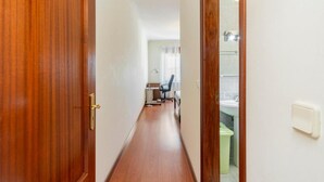 A hallway with wooden flooring and a door on the left. - Douro 3 Bedrooms Magic Mountain Landscape (Vila Flor)