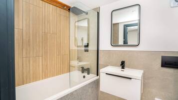 Shower, hair dryer, towels, shampoo