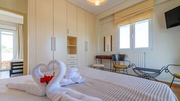 1 bedroom, desk, iron/ironing board, travel crib