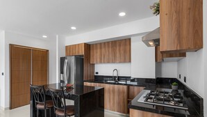 Junior Apartment | Private kitchen | Coffee/tea maker, full-sized fridge, microwave, oven - Zoho Skies by Monyxbnb (Puerto Vallarta)