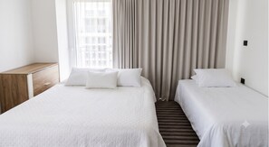 Apartamento design | Roupas de cama premium, cofres nos quartos