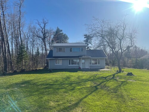 Charming house on the St. Mary's river in Sault Ste. Marie, freighters out front