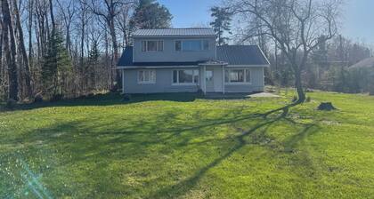 Charming house on the St. Mary's river in Sault Ste. Marie, freighters out front