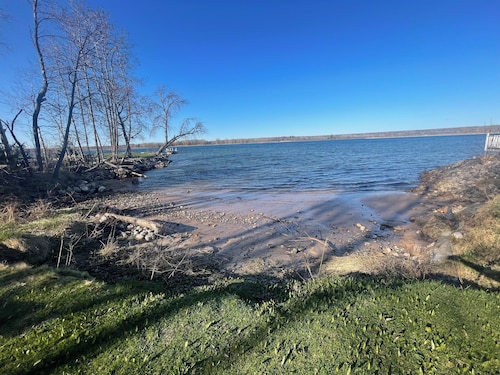 Charming house on the St. Mary's river in Sault Ste. Marie, freighters out front