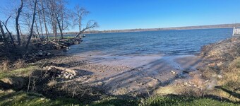 Charming house on the St. Mary's river in Sault Ste. Marie, freighters out front