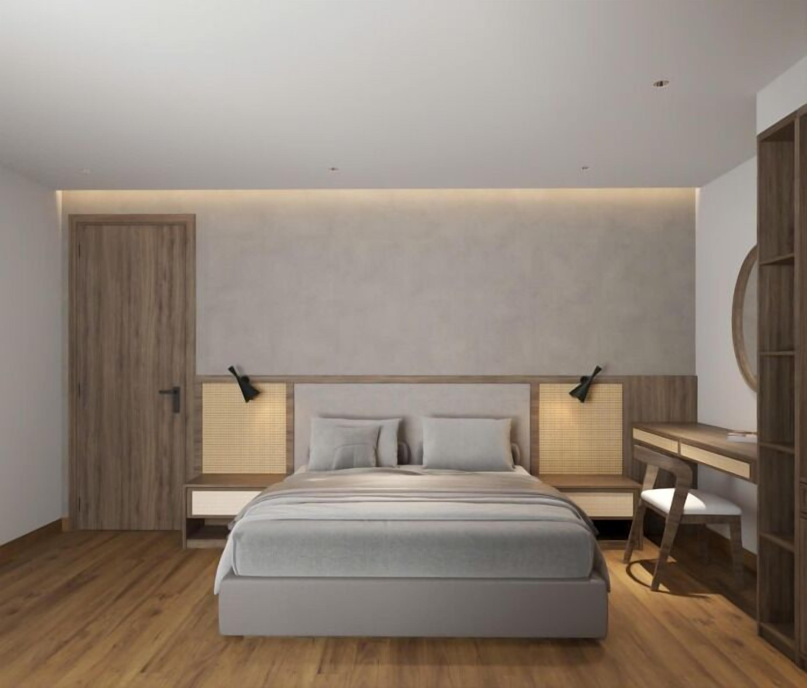 A modern bedroom with a large bed, bedside tables, a desk, and a wardrobe.