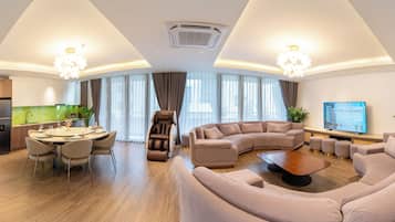 Luxury Penthouse | Living area | 40-inch flat-screen TV with cable channels